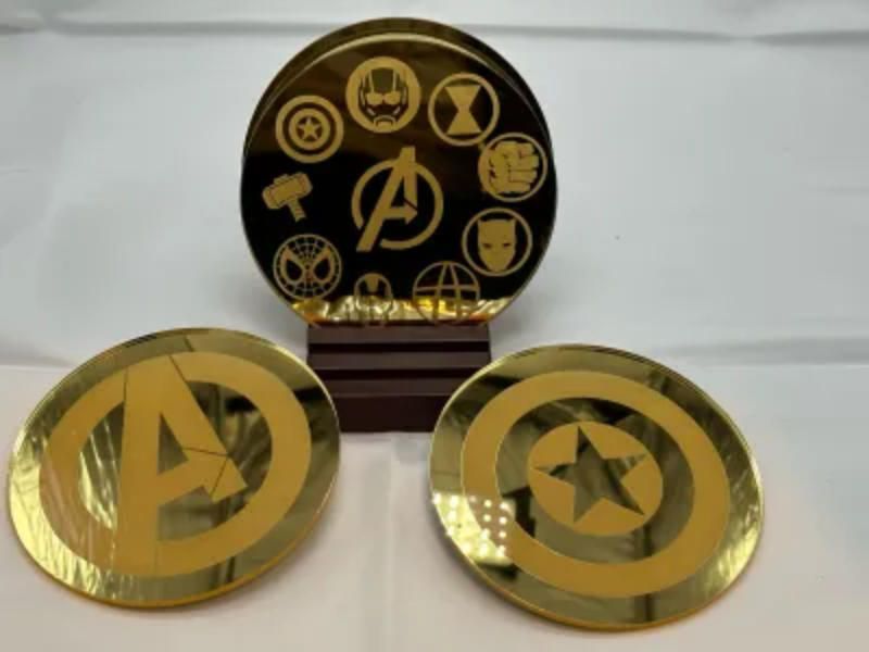 Mirror Coaster Set laser cut design on a table