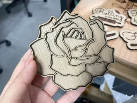 Set of laser cut wooden coasters engraved with detailed rose designs