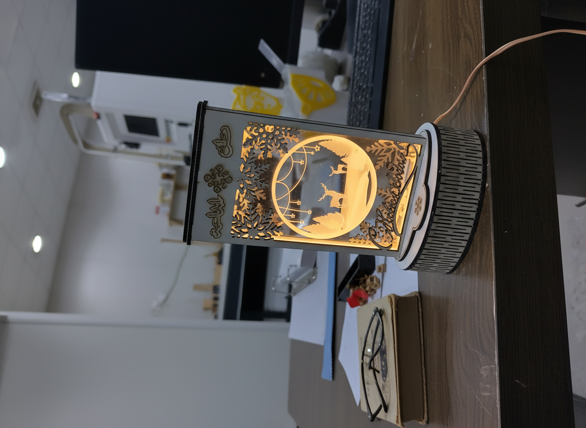 Luz de mesa iluminada con ciervo y copo de nieve navideño