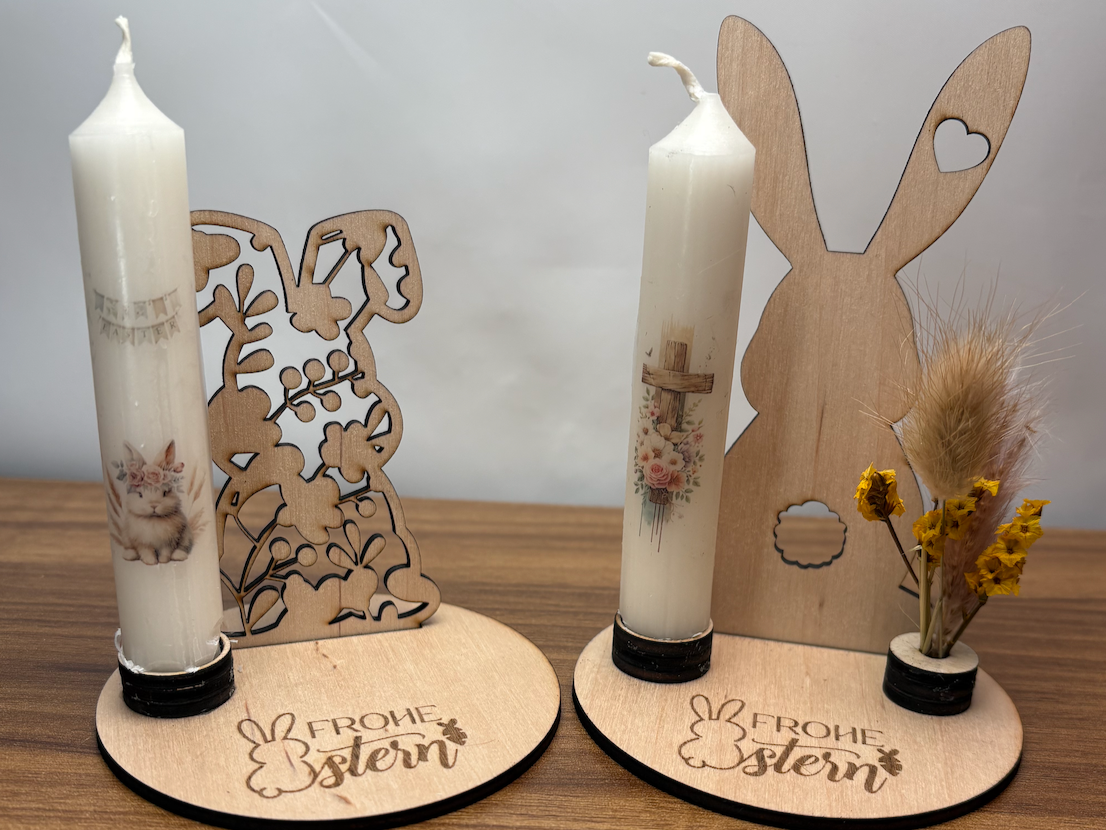 Wooden bunny candle holders with Frohe Ostern Easter decorations glowing
