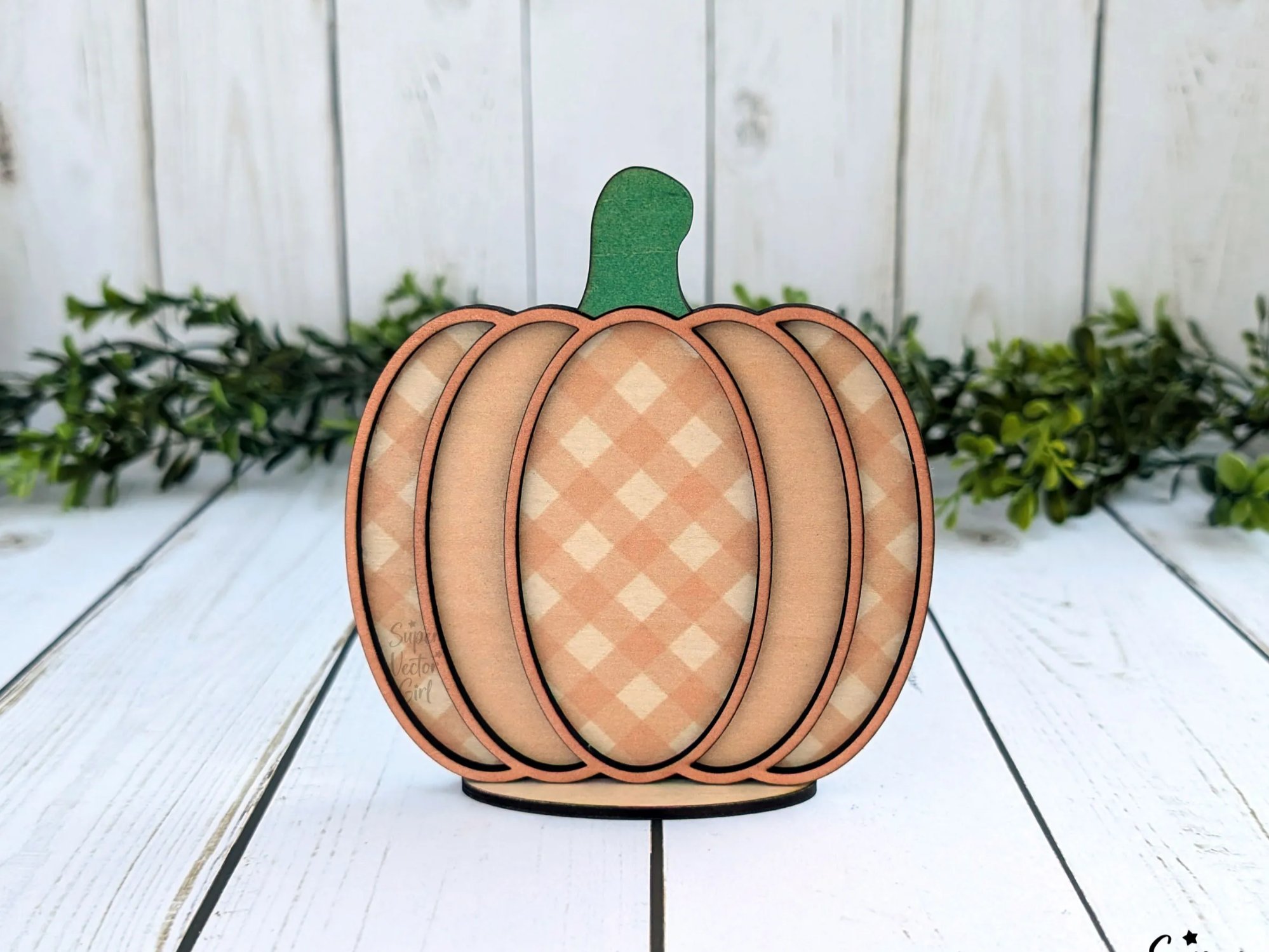 Gingham-patterned pumpkin shelf sitter decoration