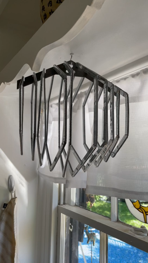 [Laser cut and engrave] Modern hexagonal mirror art installation with reflective surfaces