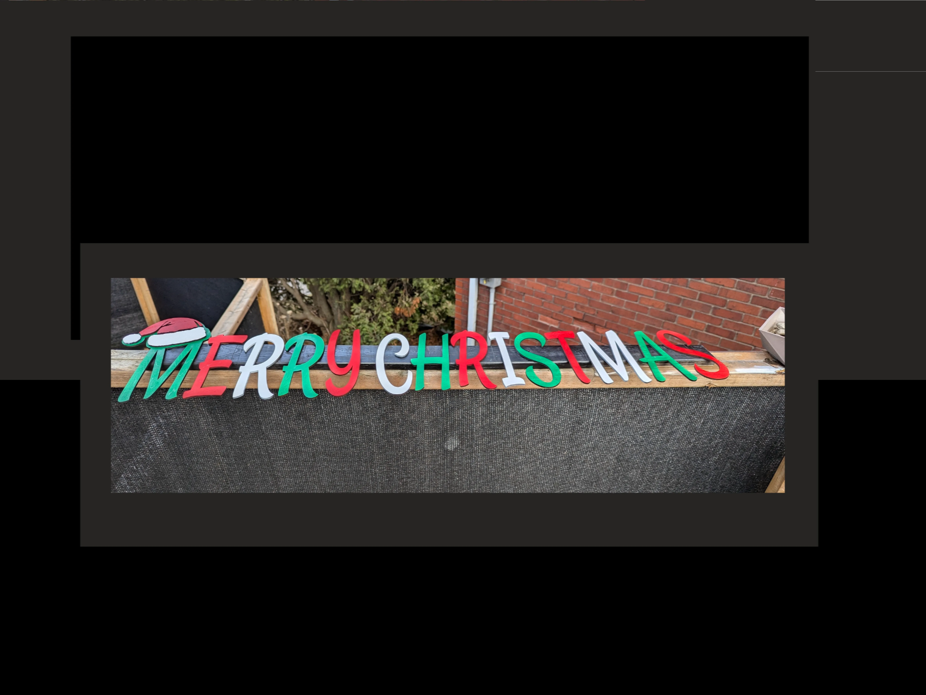 Four foot tall Merry Christmas yard sign with Santa hat decoration