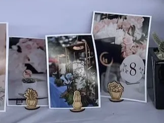 Wooden cactus-shaped photo holder gripping a small picture