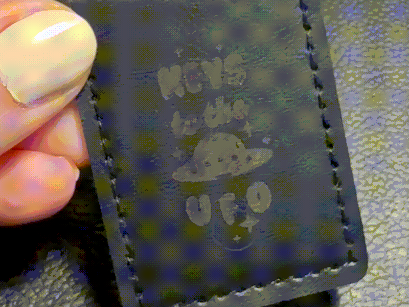 Black Leather Keychain with Keys to the UFO Text and Spaceship Motif