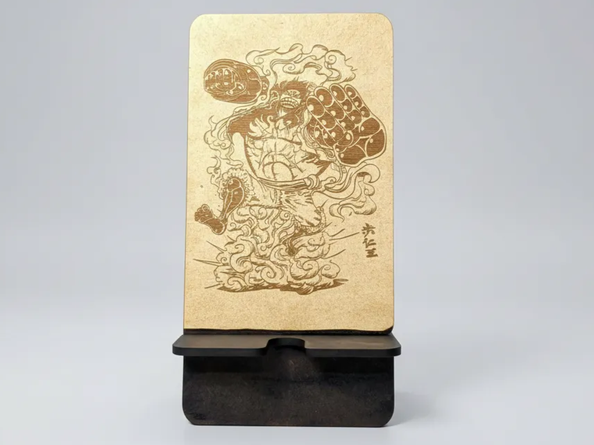 Wood engraved phone stand with Luffy Gear illustration and calligraphy gift idea