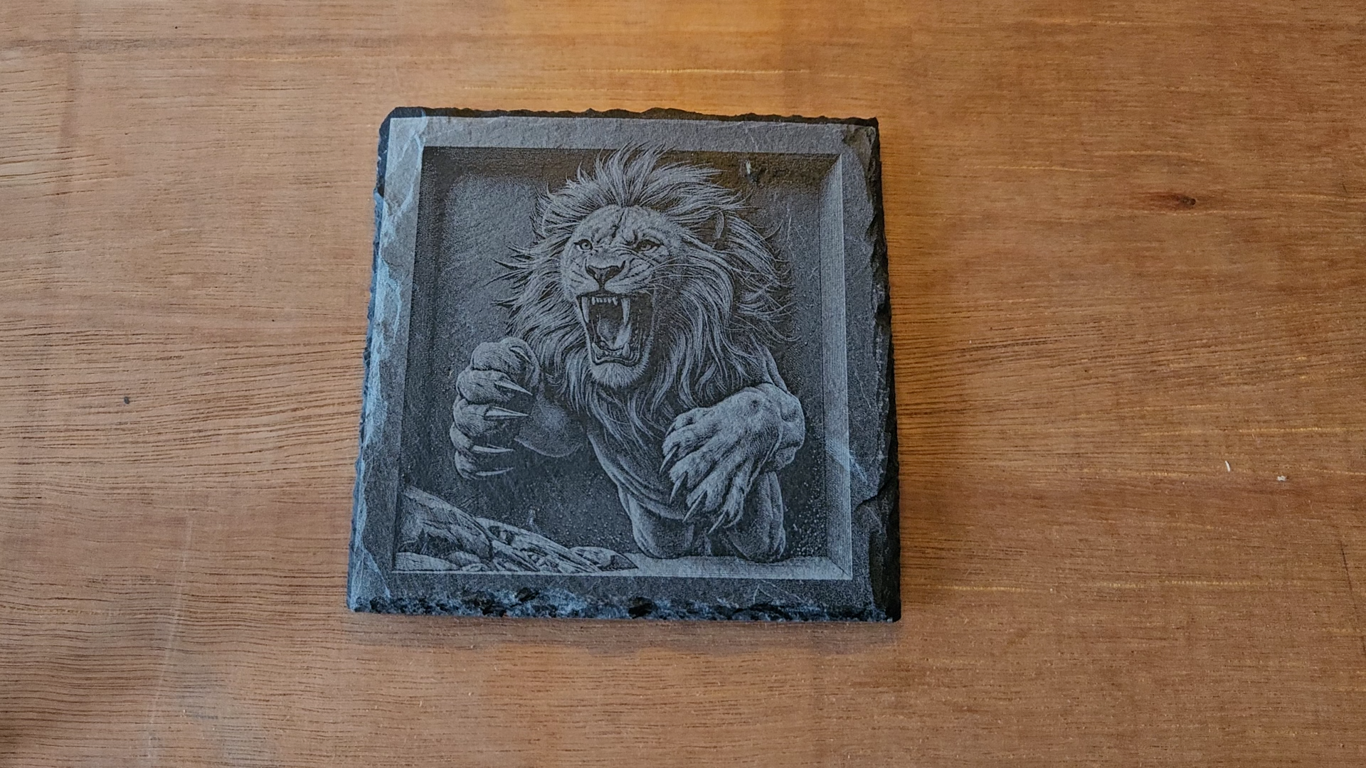 Lion mid-leap in attack pose engraved with dimensional shading