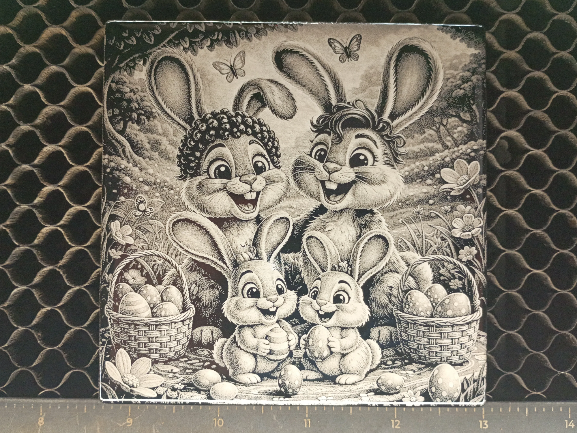 Laser engraved and painted tile of an Easter bunny family free SVG design
