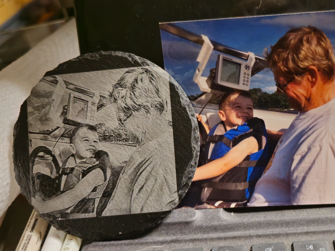 Black slate coaster engraved with a father and son photo