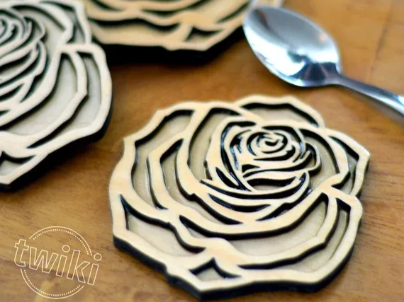 Laser engraved wooden coaster featuring a rose design