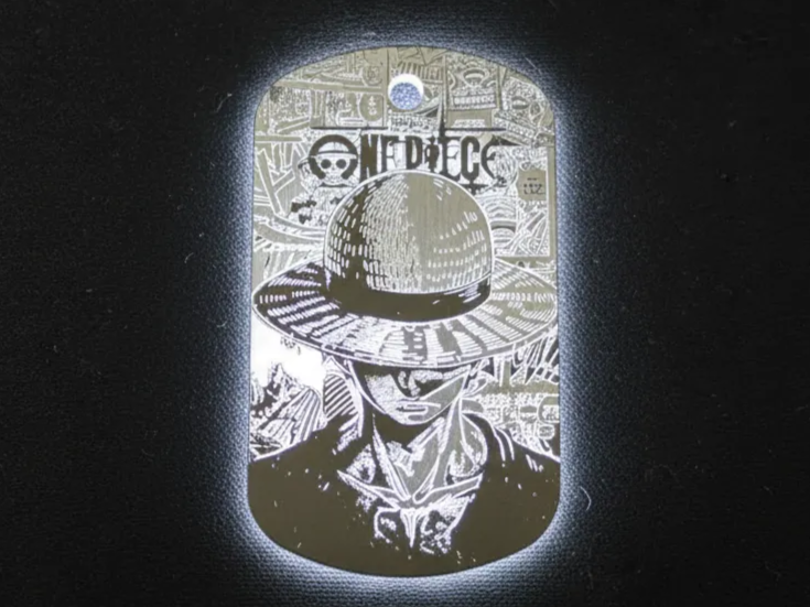 Metal dog tag engraved with Luffy portrait and One Piece logo pendant gift idea