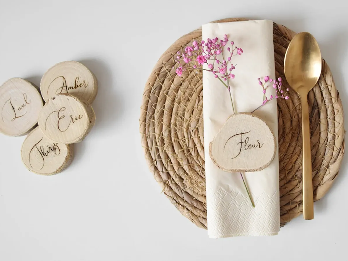 Wooden name plates used as wedding place settings