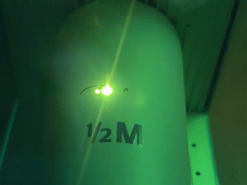 Cylindrical tumbler with 1/2 M branding