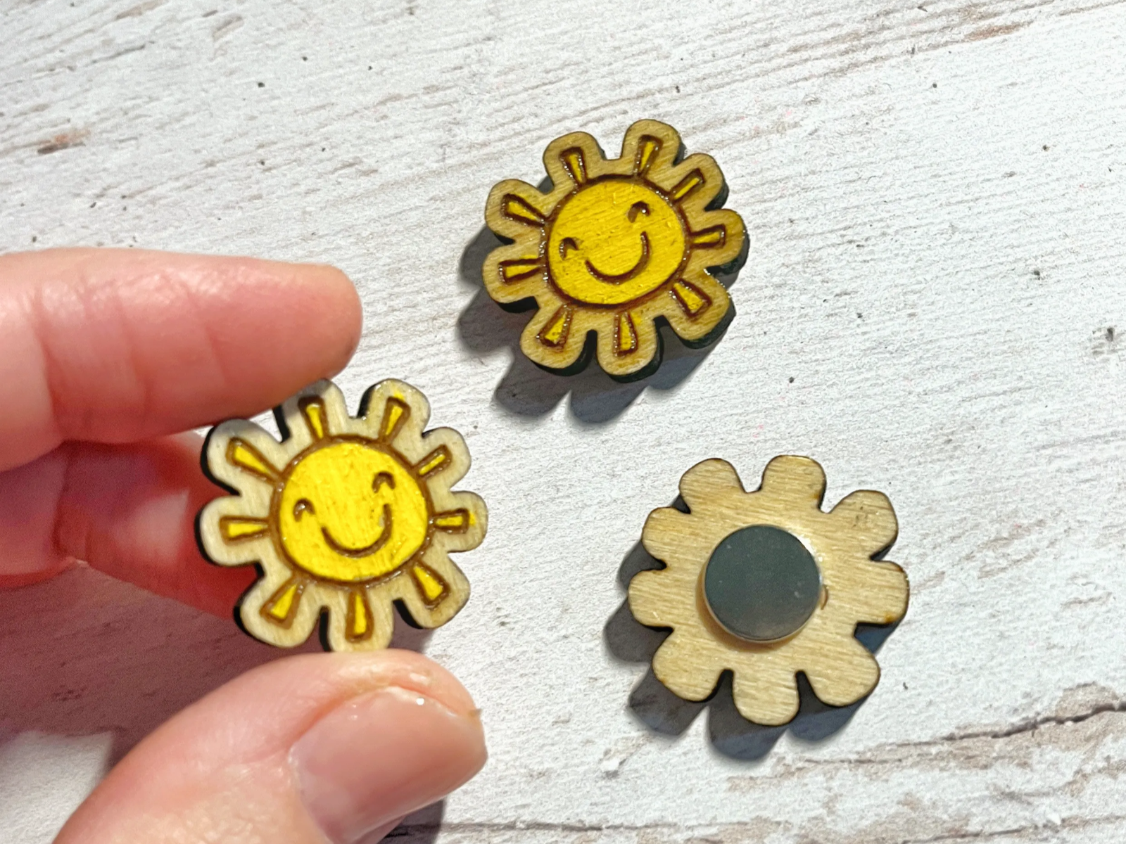 Mini wooden sun magnets with cheerful smiling faces