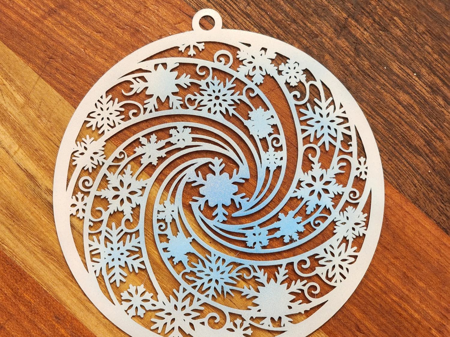 Swirling-Pattern Snowflake ceiling Christmas decoration idea