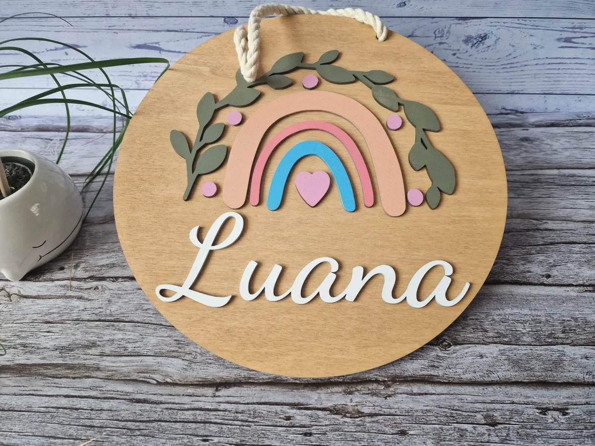 Personalized wooden name sign painted in soft pastel colors