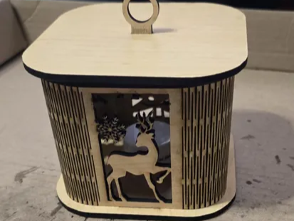 Wood Christmas bendy lantern with a curved living-hinge body