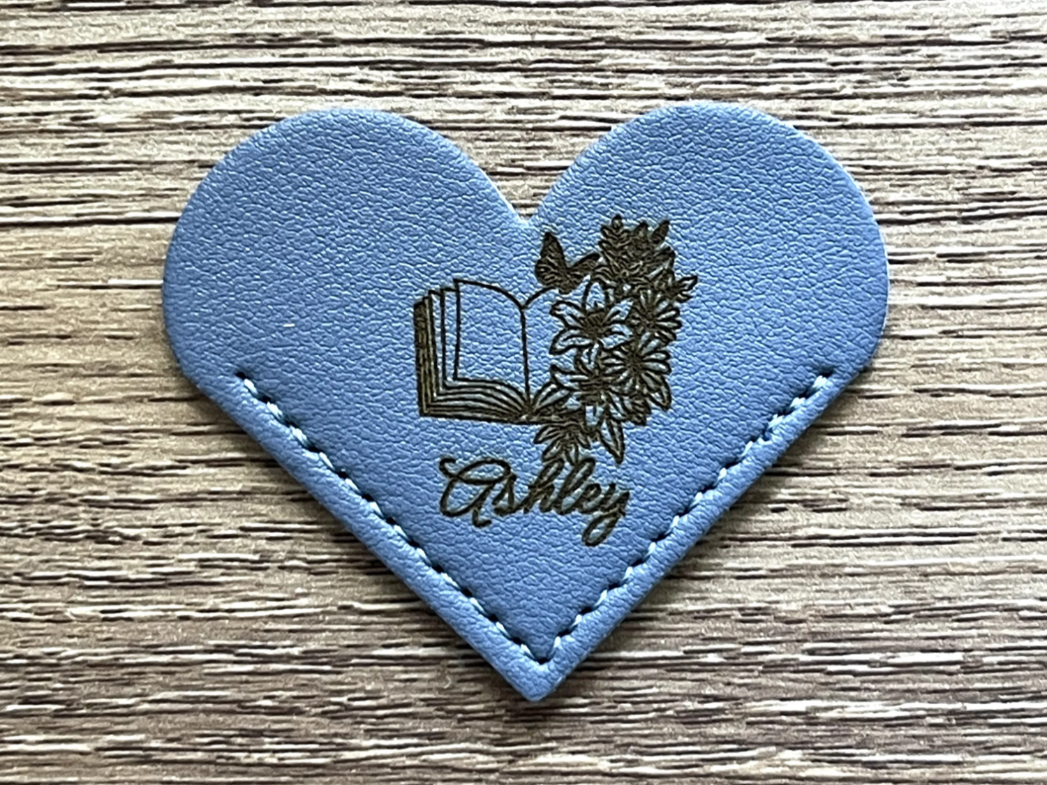 Heart-Shaped Leather Bookmark with Name, Book, and Floral Design mother's day gift design