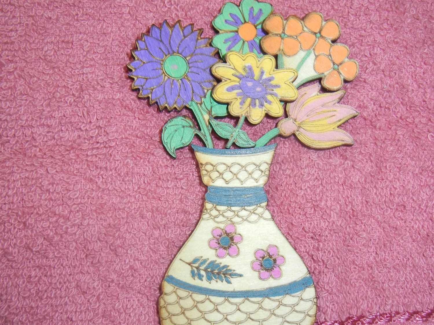 Colourful handmade wooden vase with laser-cut flower decoration