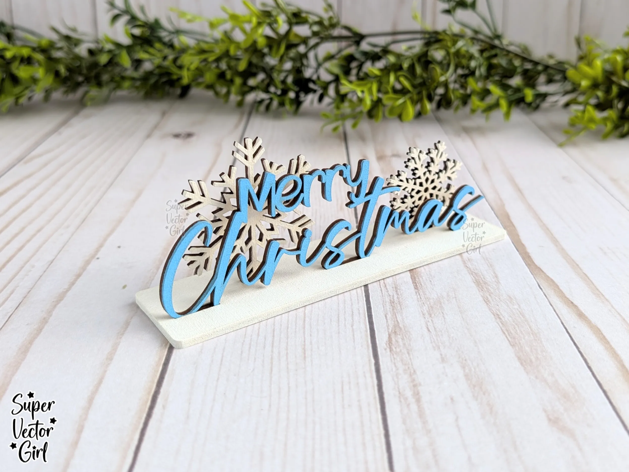 Merry Christmas Shelf Sitter with Snowflakes laser-cut design on a styled shelf