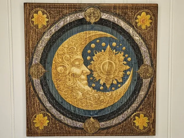 Intricate moon and sun wall art with ornate details