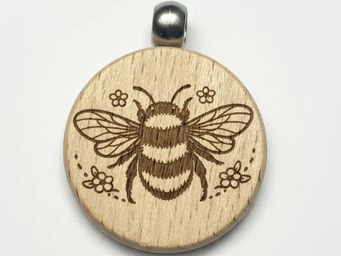 Laser Engraved Wooden Bee Pendant with Floral Design design