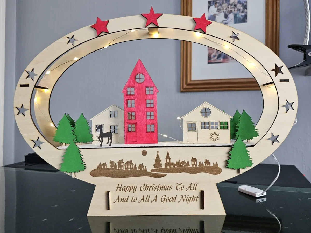 Desa Natal 3D yang dipotong dengan laser dengan pemandangan dekorasi luar ruangan yang bersinar