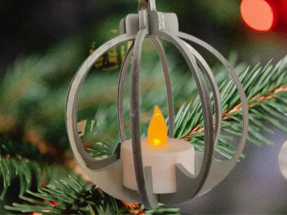 Laser cut wooden Christmas ornament with an LED candle decoration