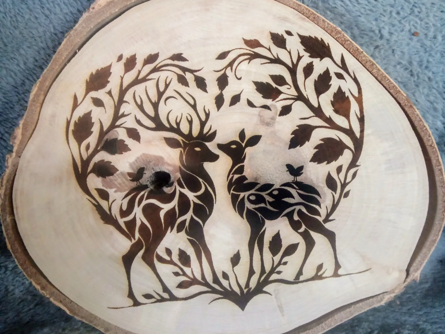 Woodland deer scene engraved on a natural wood slice ornament