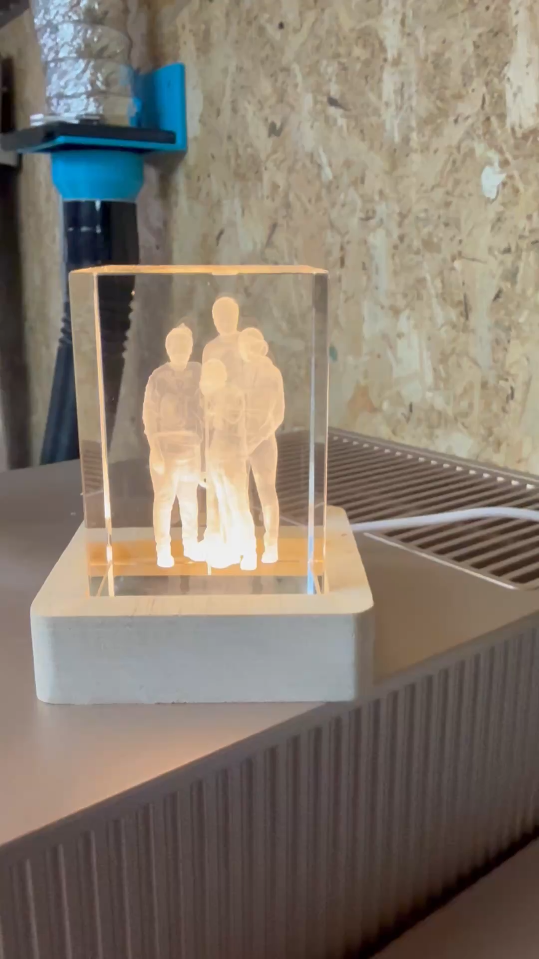 Illuminated crystal block featuring a family portrait silhouette