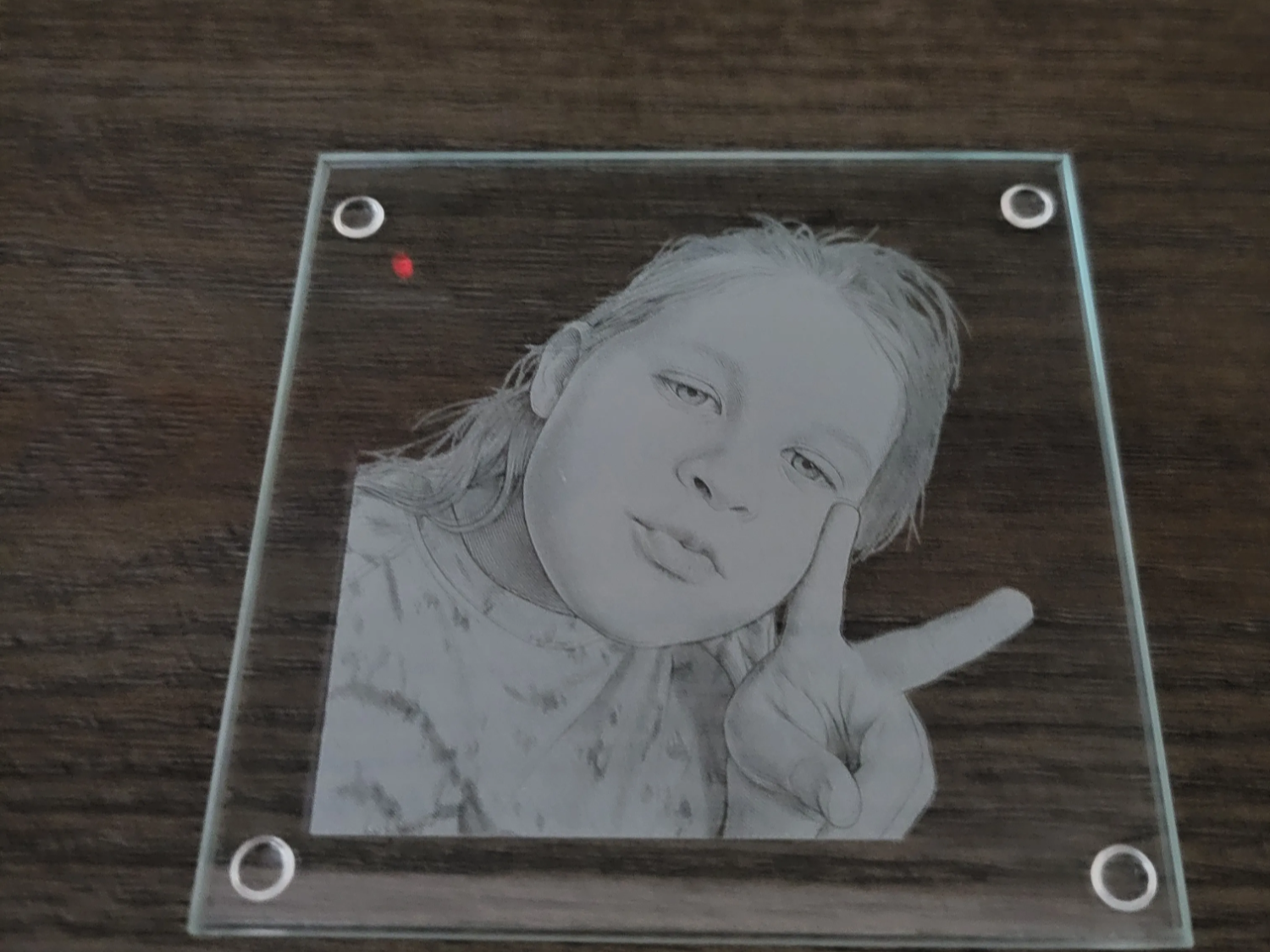 Glass coaster engraved with a child's photo portrait