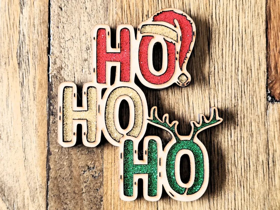 HO HO HO text ornament decorated with Santa hat and antlers