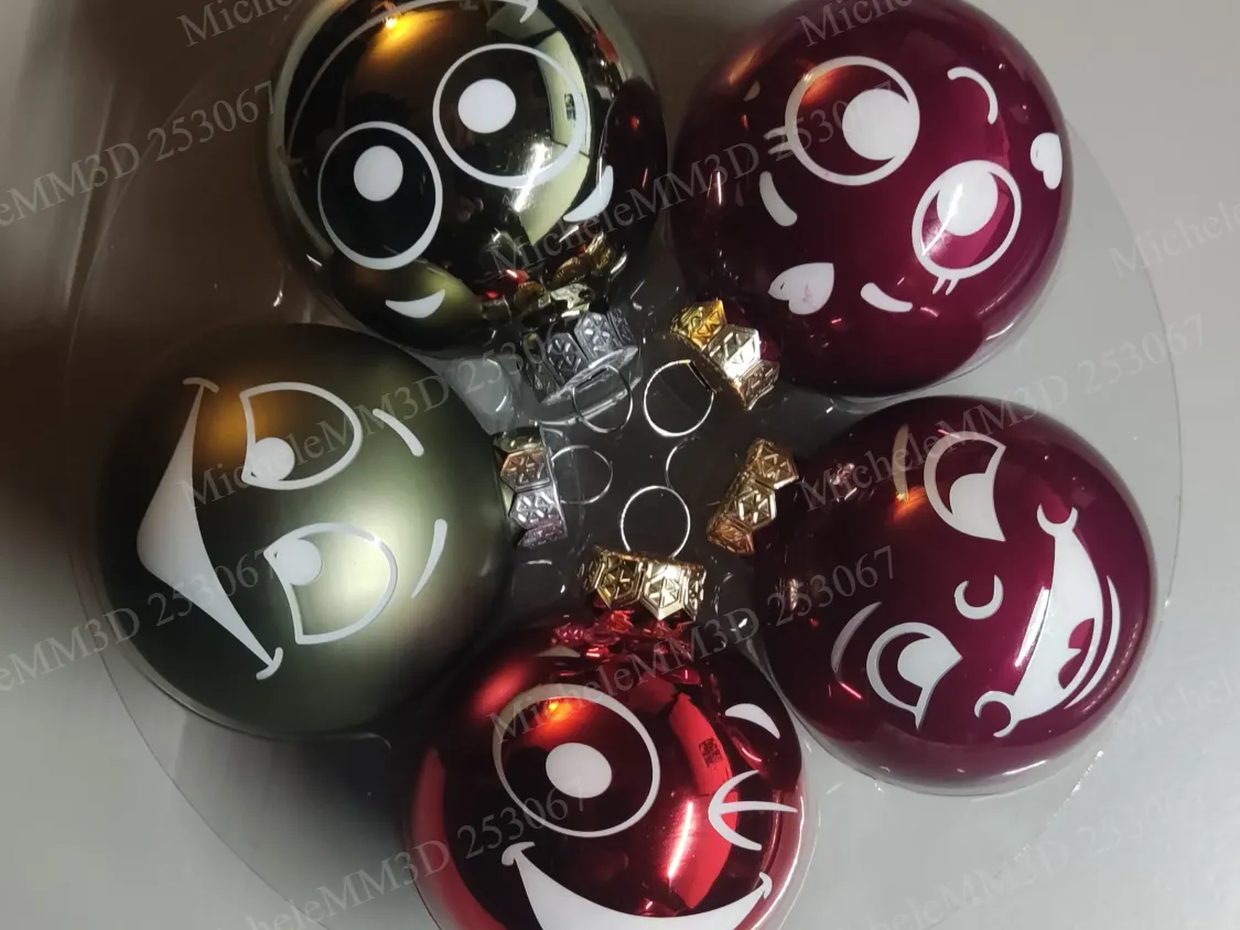 Set of Christmas ornaments featuring cute smiling character faces