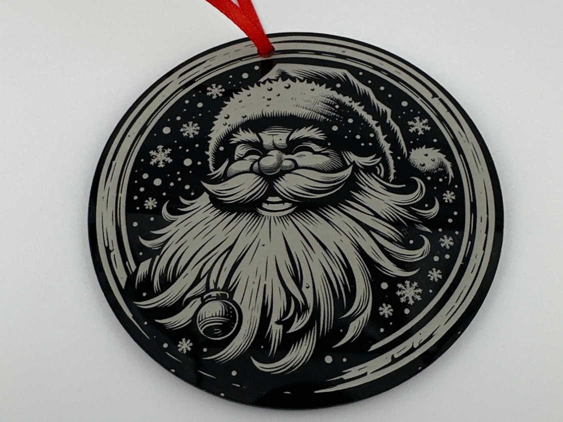 Laughing Santa acrylic ornament hanging in a Christmas window