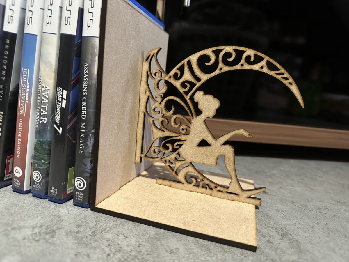 Wooden Moon and Fairy Bookend laser-cut design on a styled shelf