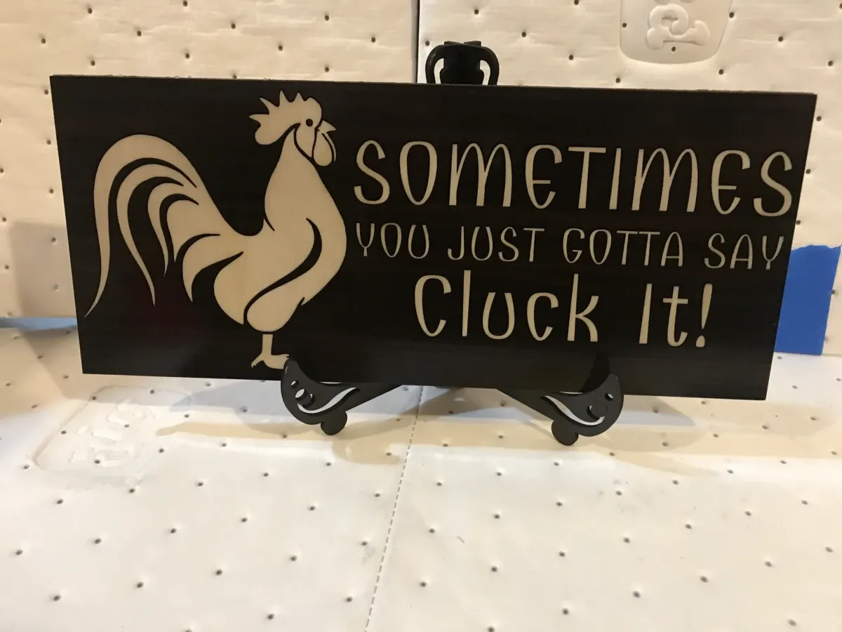 Petite pancarte en bois « Just Cluck It »
