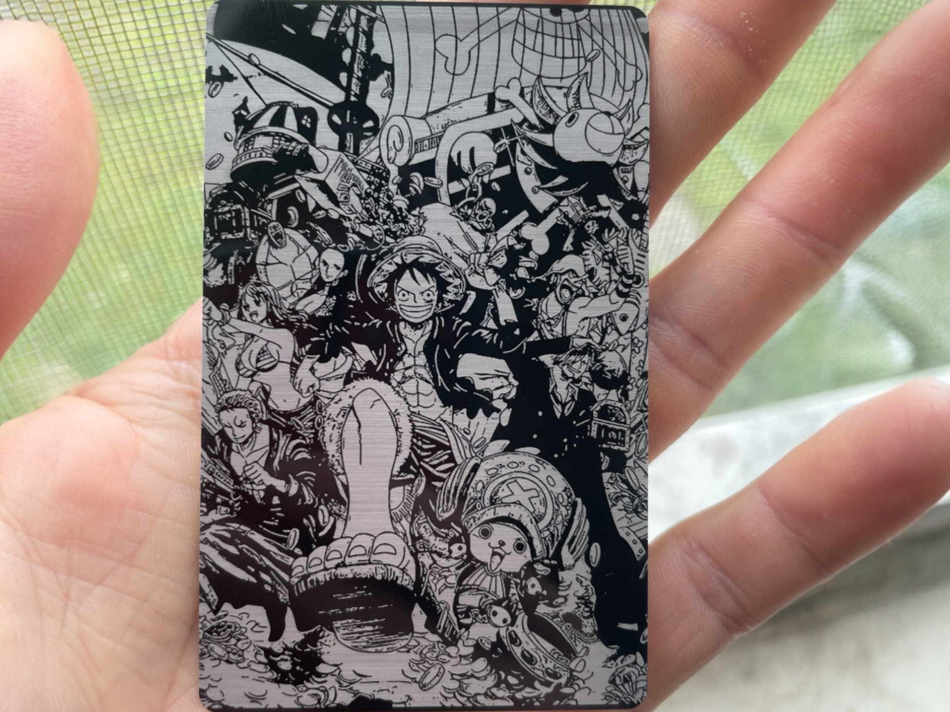 Metal card engraved with full One Piece crew illustration wallet card gift idea