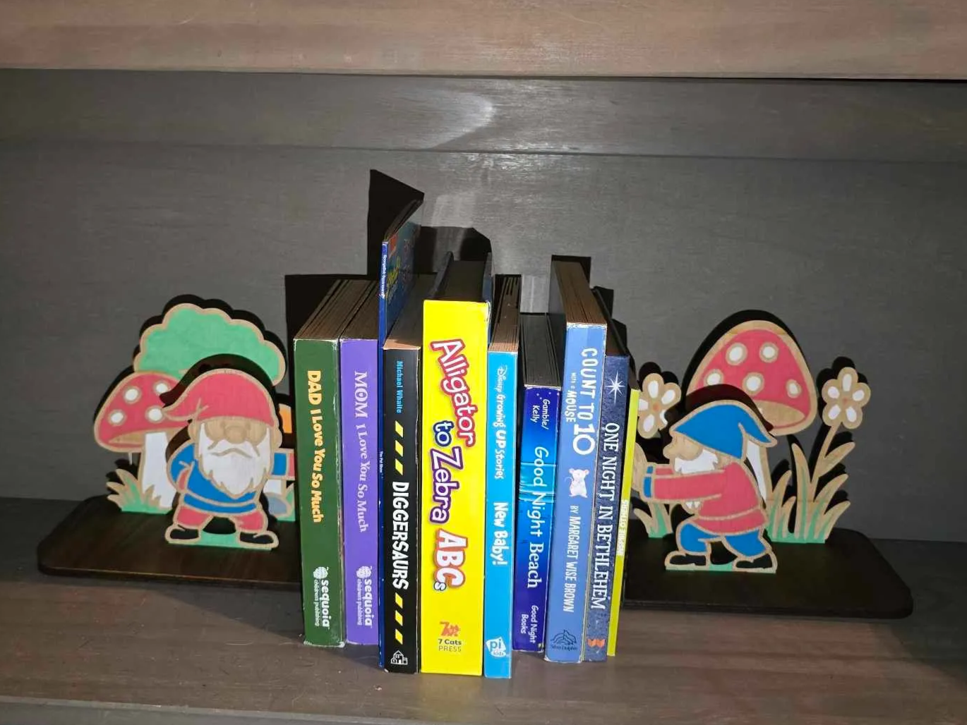Gnome Bookends with Mushrooms and Trees laser-cut design on a styled shelf