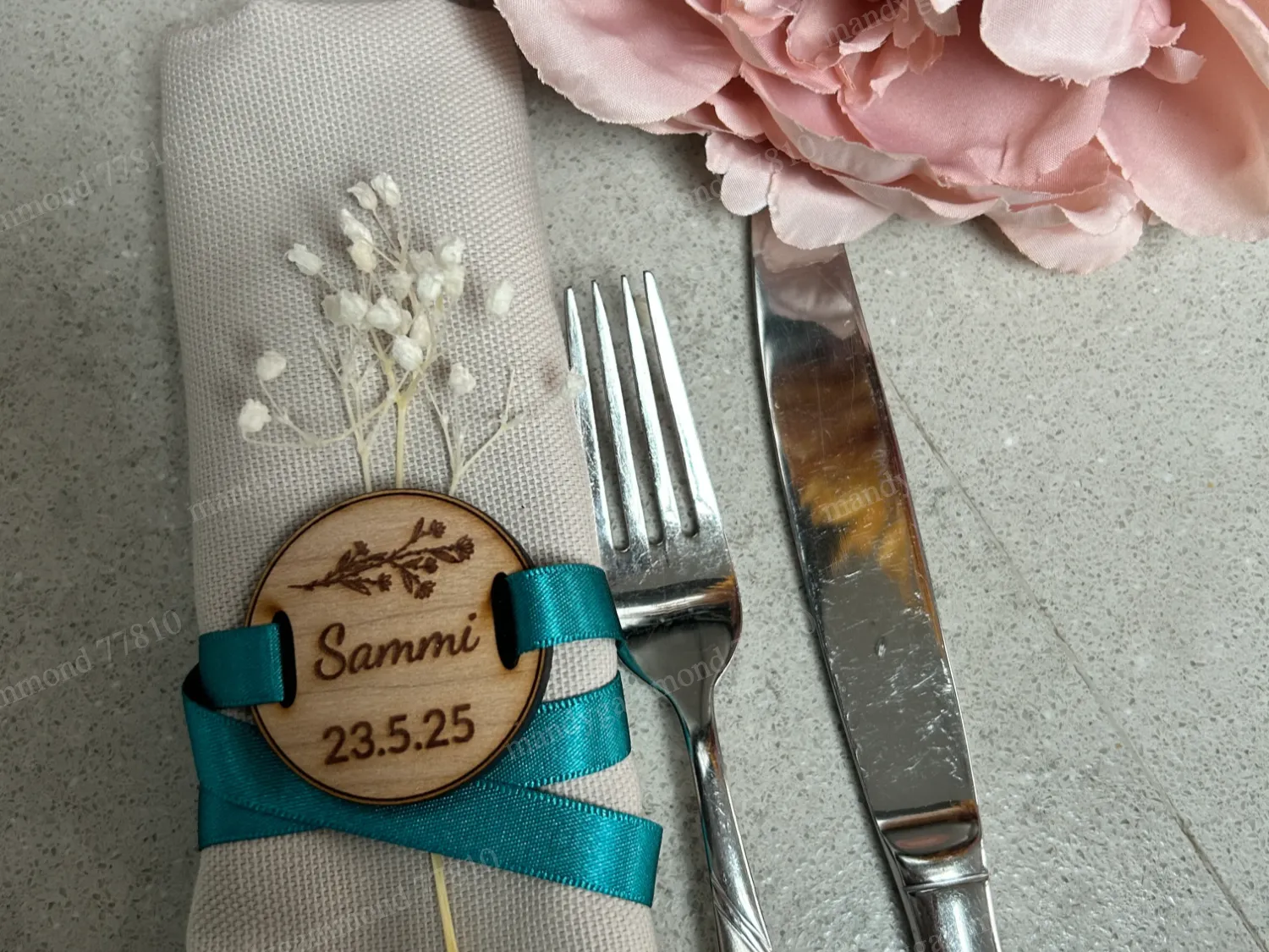 Round wooden napkin ring that displays a guest place name