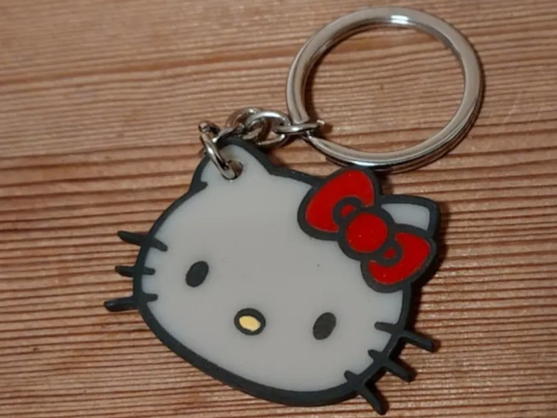 Soft rubber Hello Kitty face keychain with red bow gift idea