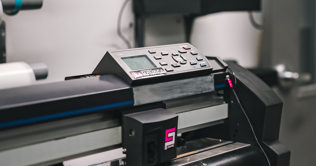 A large-format printer producing a high-resolution photo print