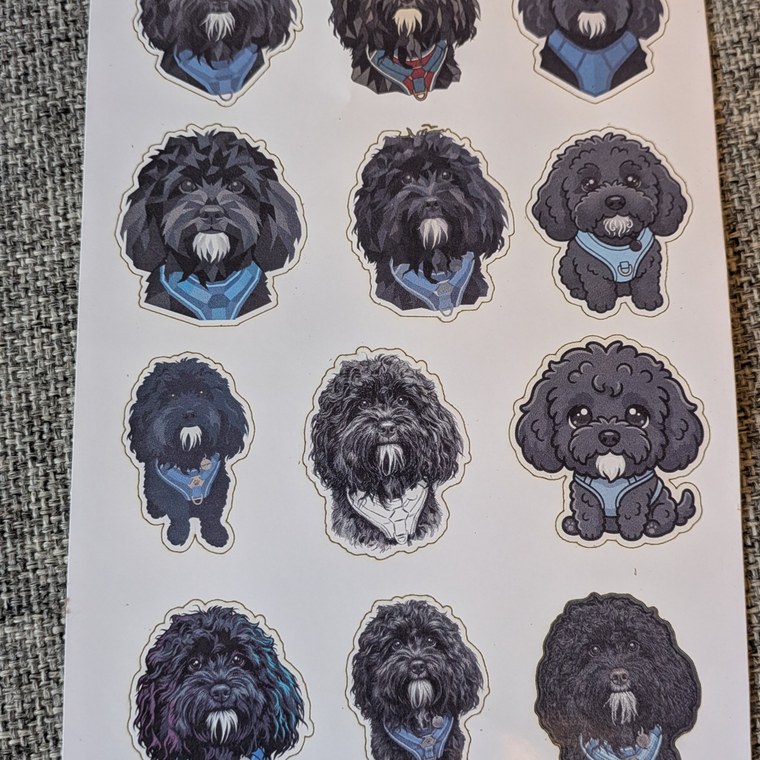A sheet of die-cut dog stickers on glossy sticker paper, made on an xTool M2