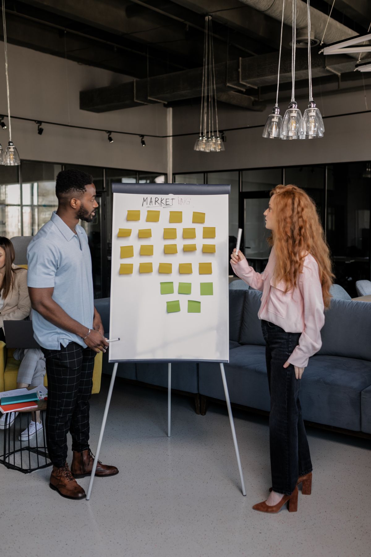 A startup team brainstorming at a whiteboard