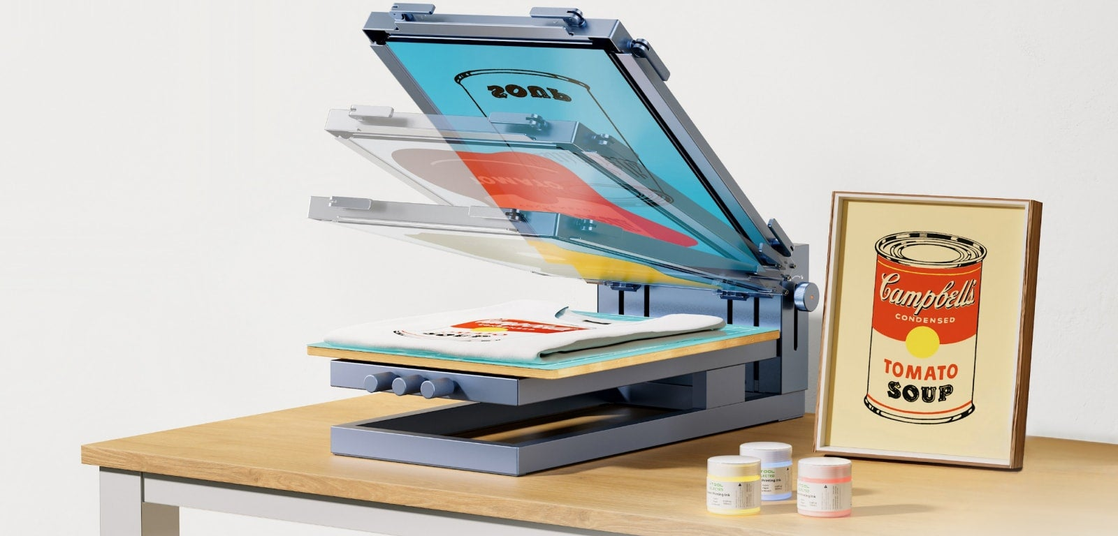 The xTool Screen Printer beside a finished screen-printed poster and inks